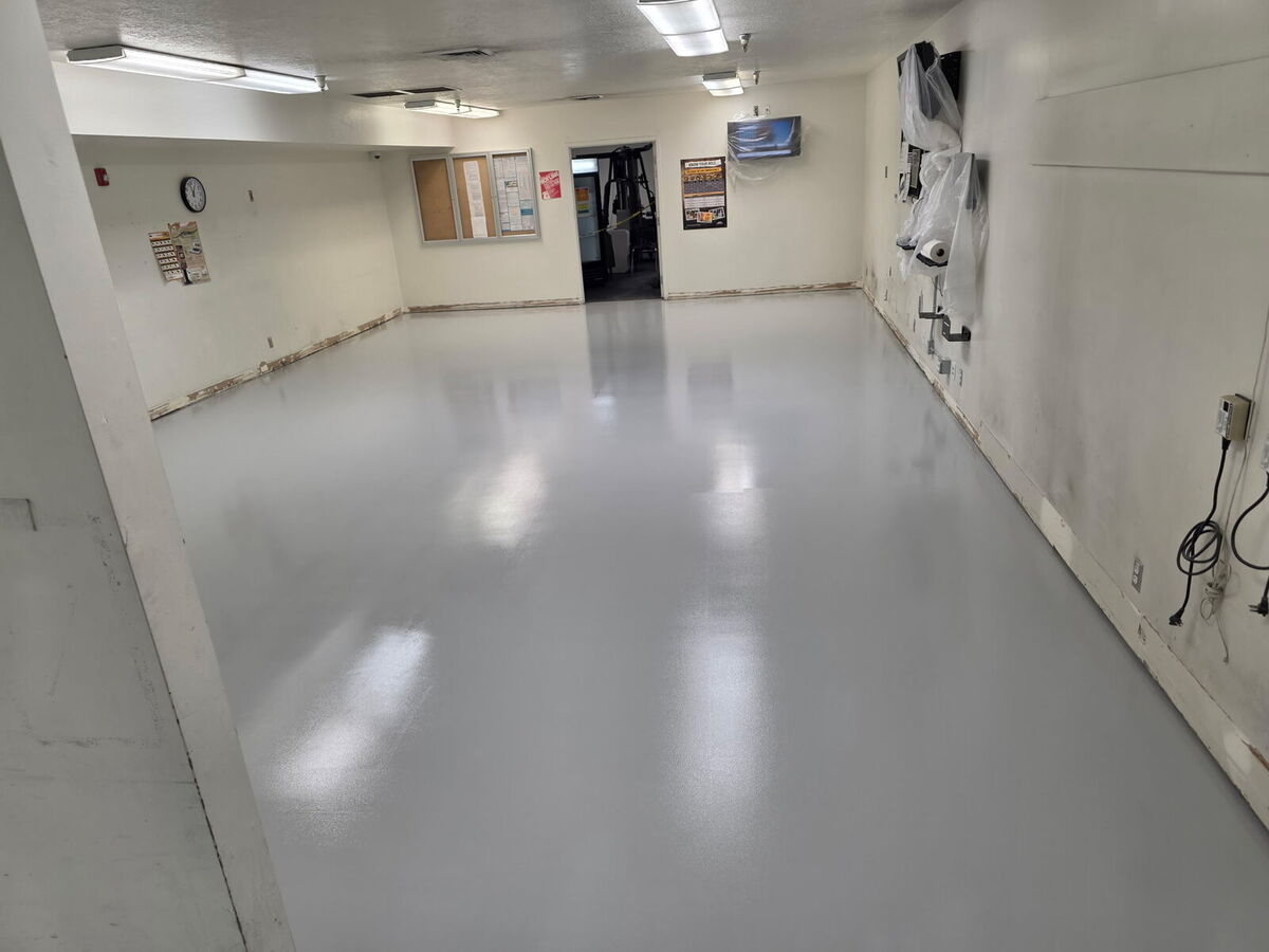 Employee break room floor coated in gray epoxy