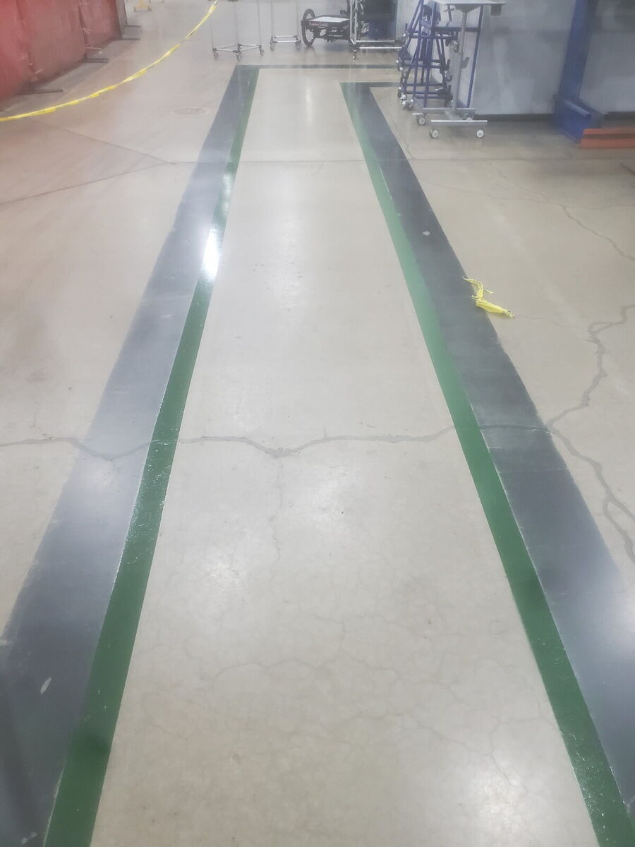 Warehouse aisle with safety striping in epoxy