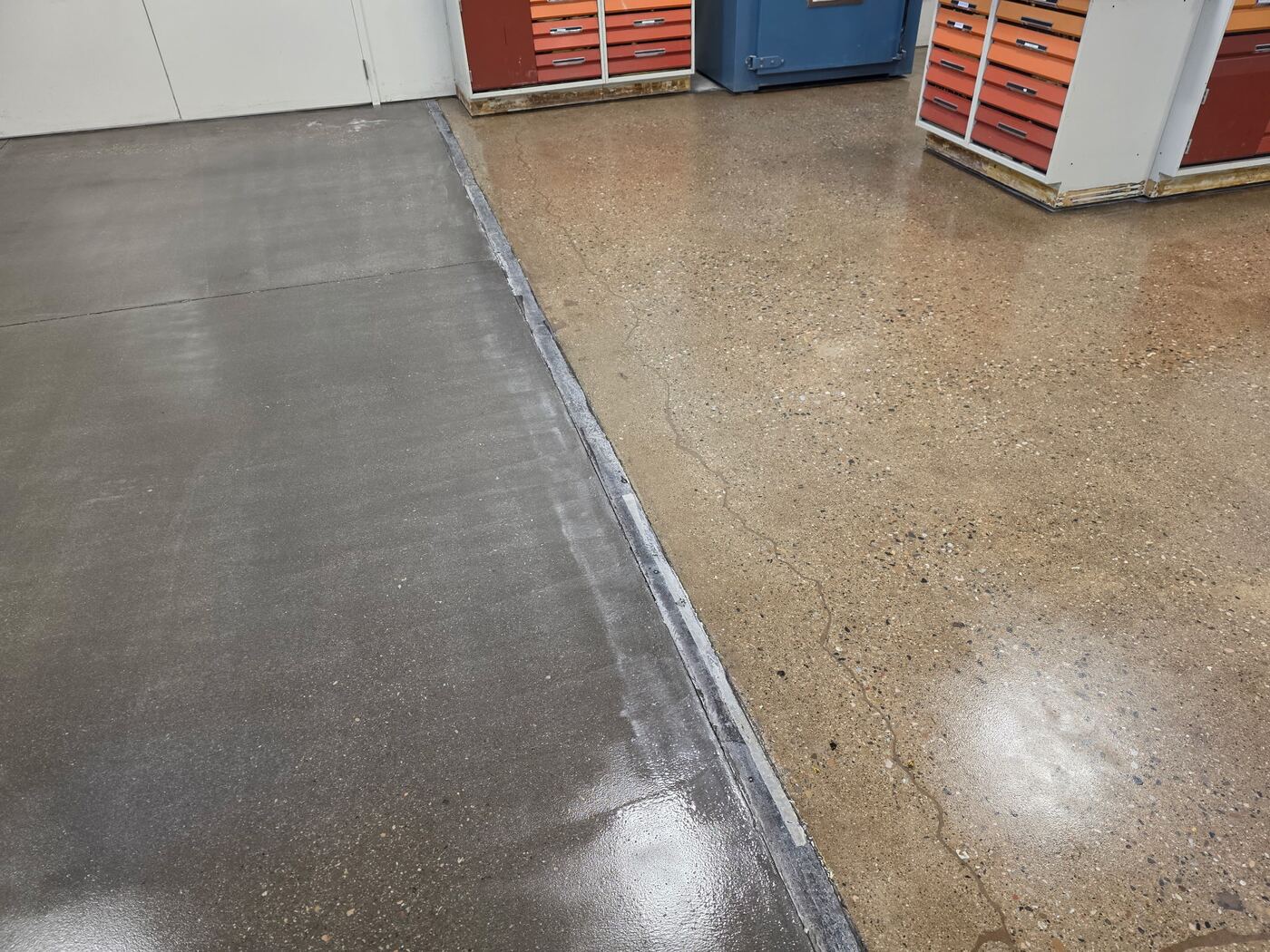 Polished and unpolished concrete floor joint in a manufacturing facility