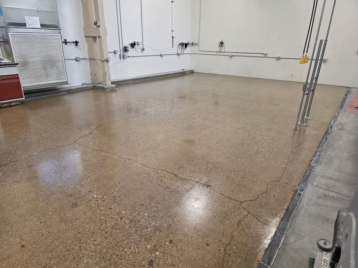 Polished concrete floor in a manufacturing facility work area