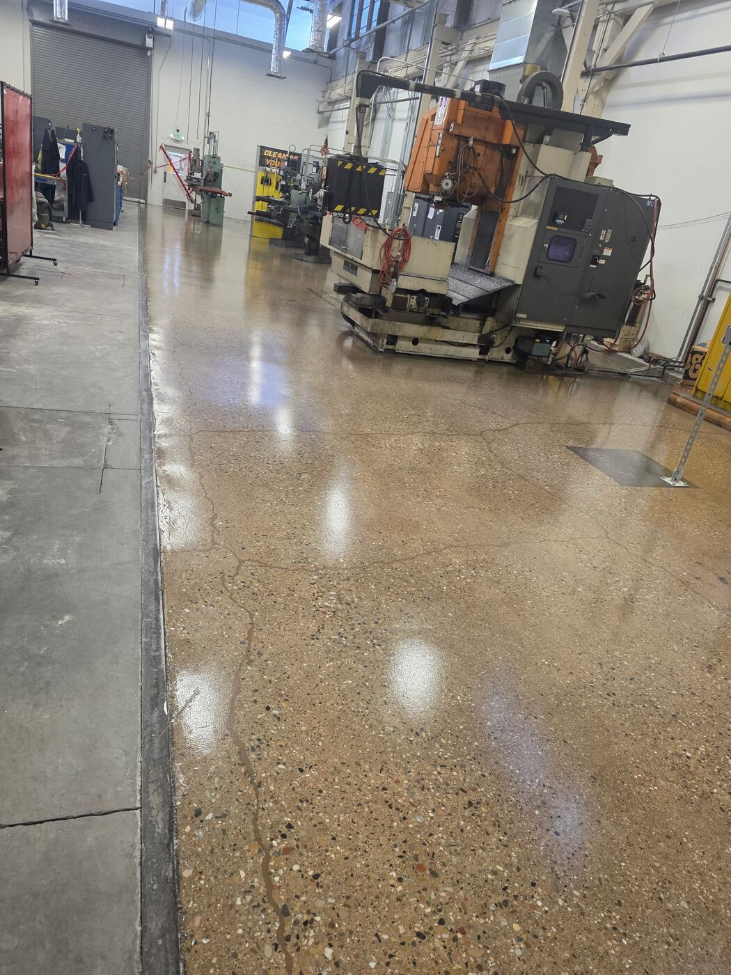 Polished concrete floor in a machine shop with CNC equipment