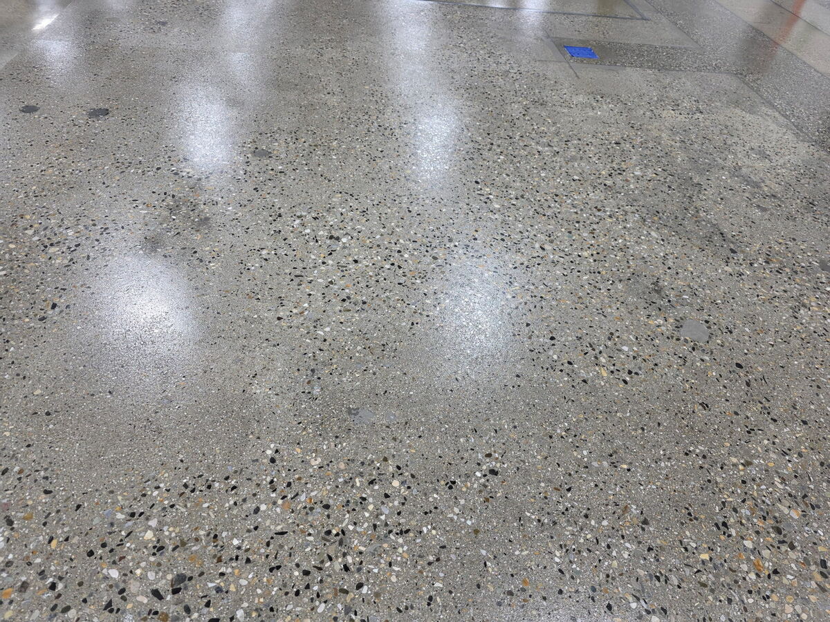 Close-up of polished concrete floor showing exposed aggregate