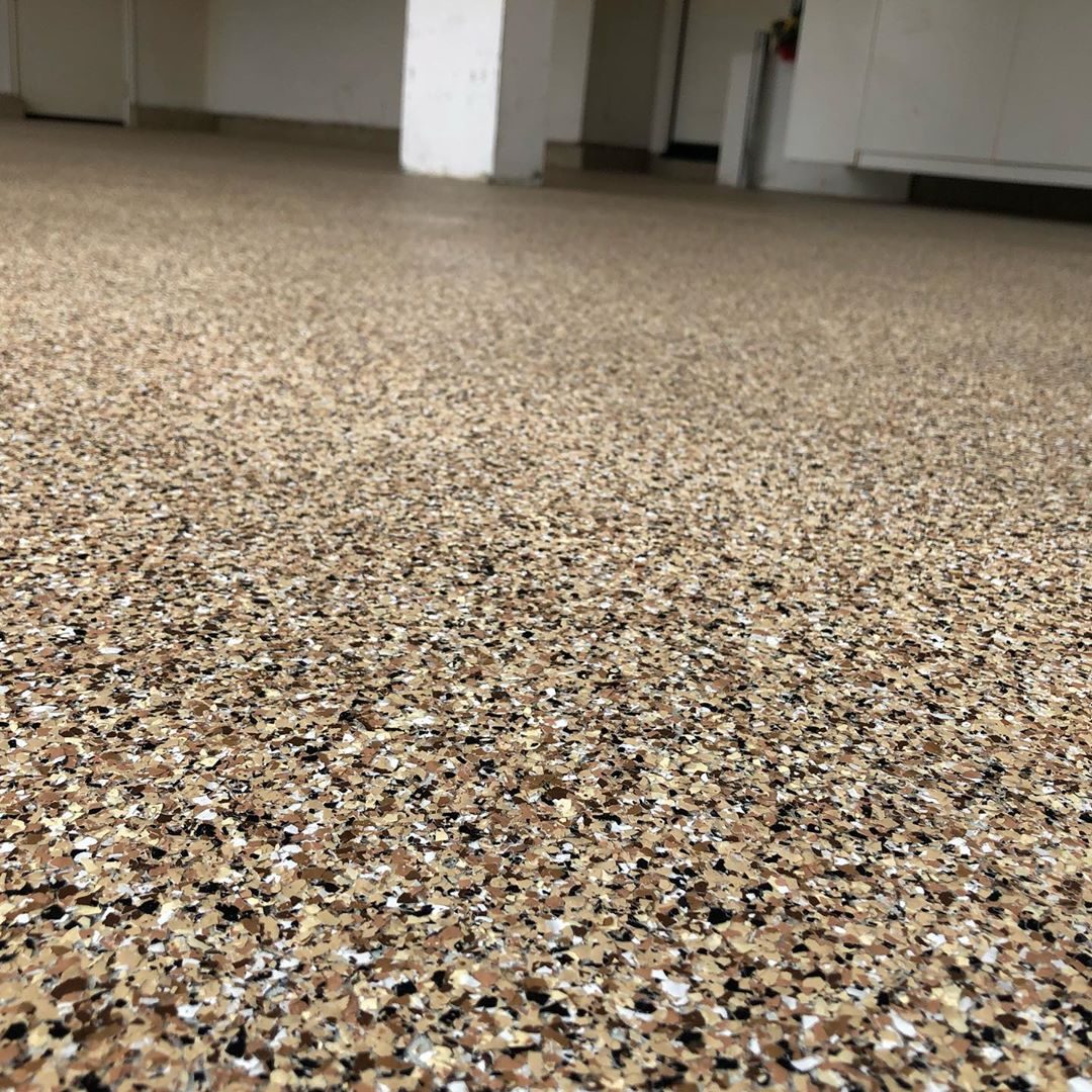 Tan and brown flake epoxy garage floor close up